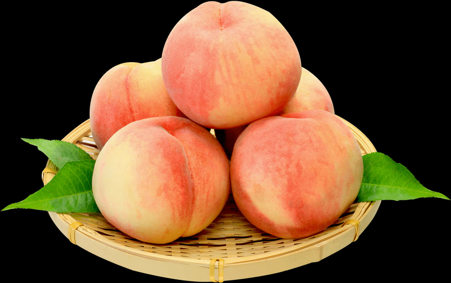 A Group Of Peaches In A Basket