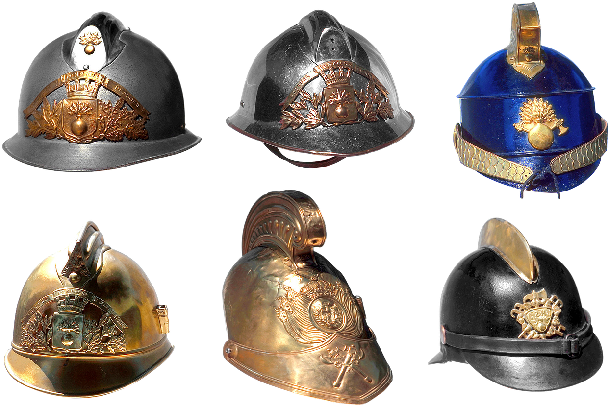 A Group Of Helmets With Gold And Silver