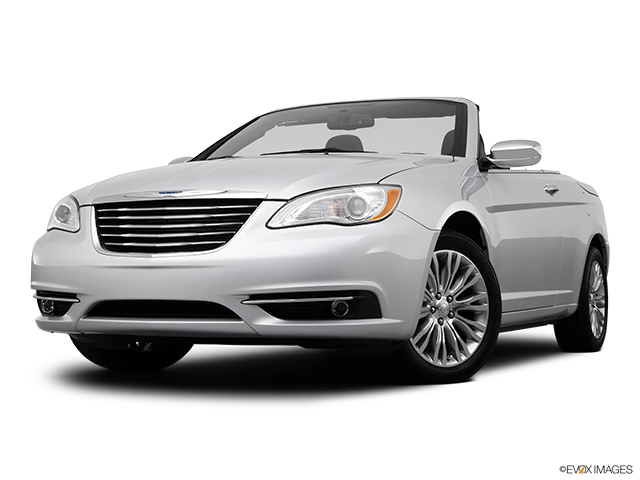 A Silver Convertible Car With A Black Background