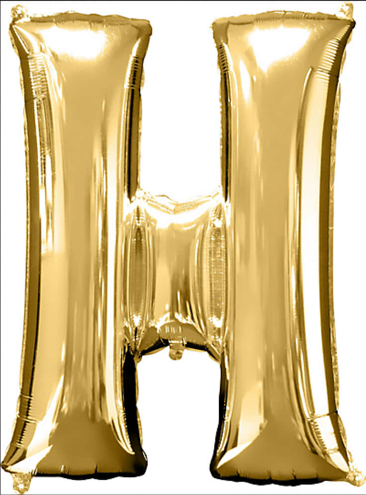 A Gold Foil Balloon In The Shape Of A Letter