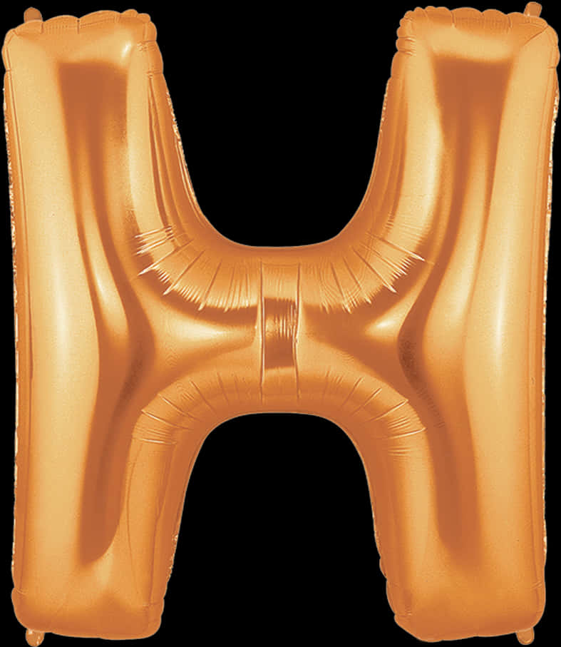 A Gold Letter H Balloon