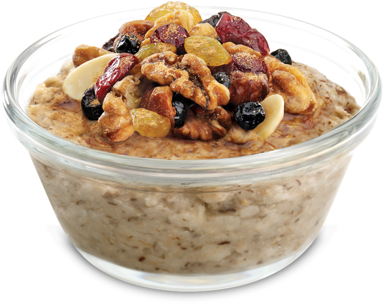 A Bowl Of Oatmeal With Nuts And Raisins