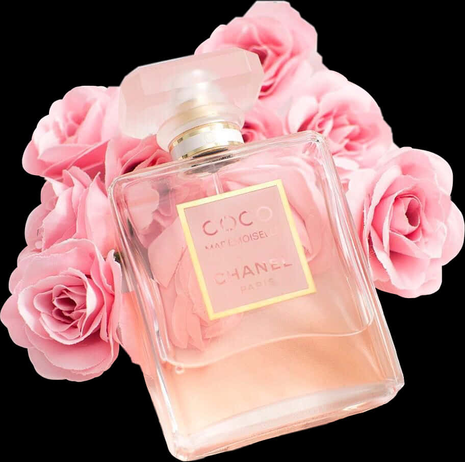 A Bottle Of Perfume And Pink Roses