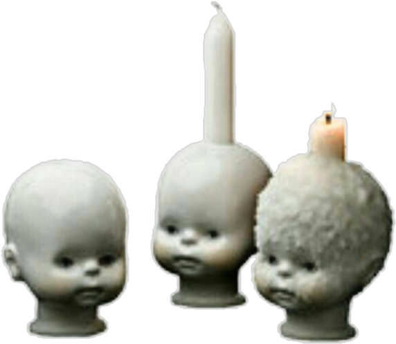 A Group Of Dolls With A Candle