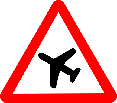 A Red And White Triangle Sign With A Black Airplane On It