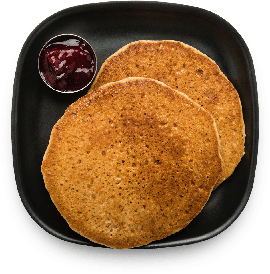 A Plate Of Pancakes With Jam