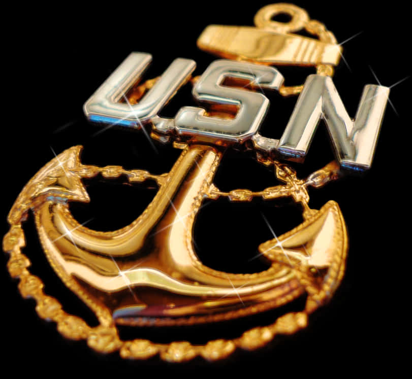 A Gold And Silver Anchor With Chain And Letters