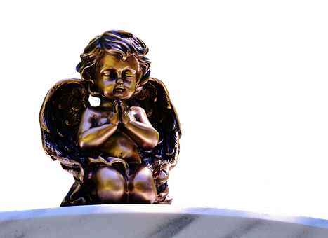 A Statue Of A Baby Angel
