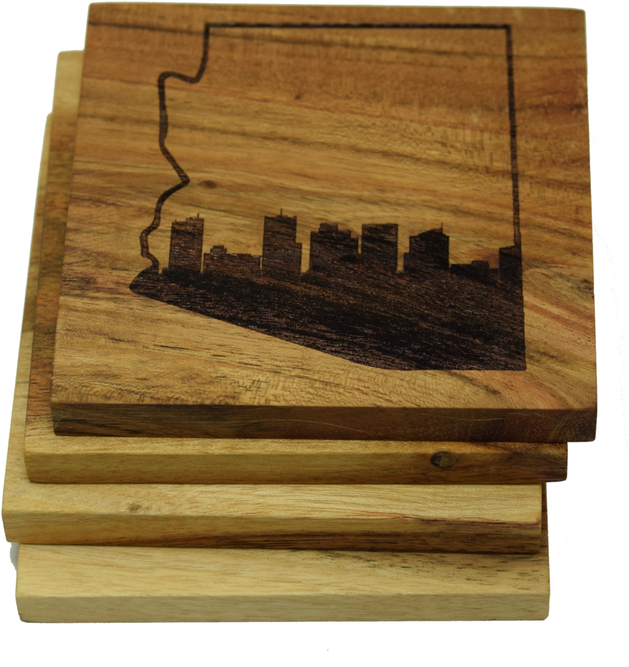 A Stack Of Wood Coasters With A City On It