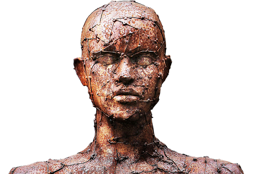 A Statue Of A Man With Rusty Nails