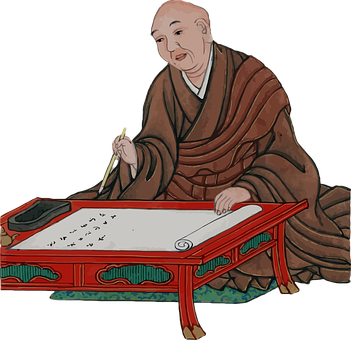 A Man Writing On A Table