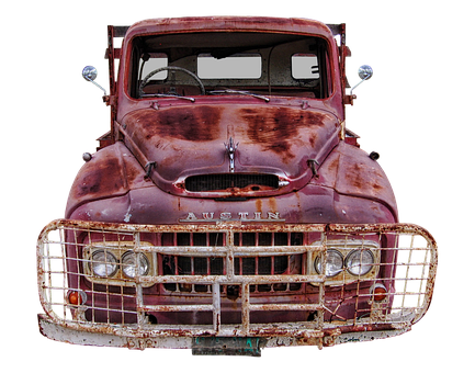 A Rusty Old Truck With A Grill
