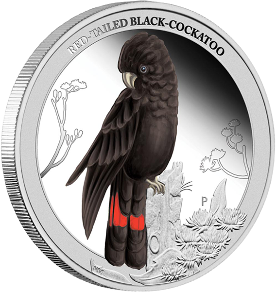A Silver Coin With A Black Bird On It