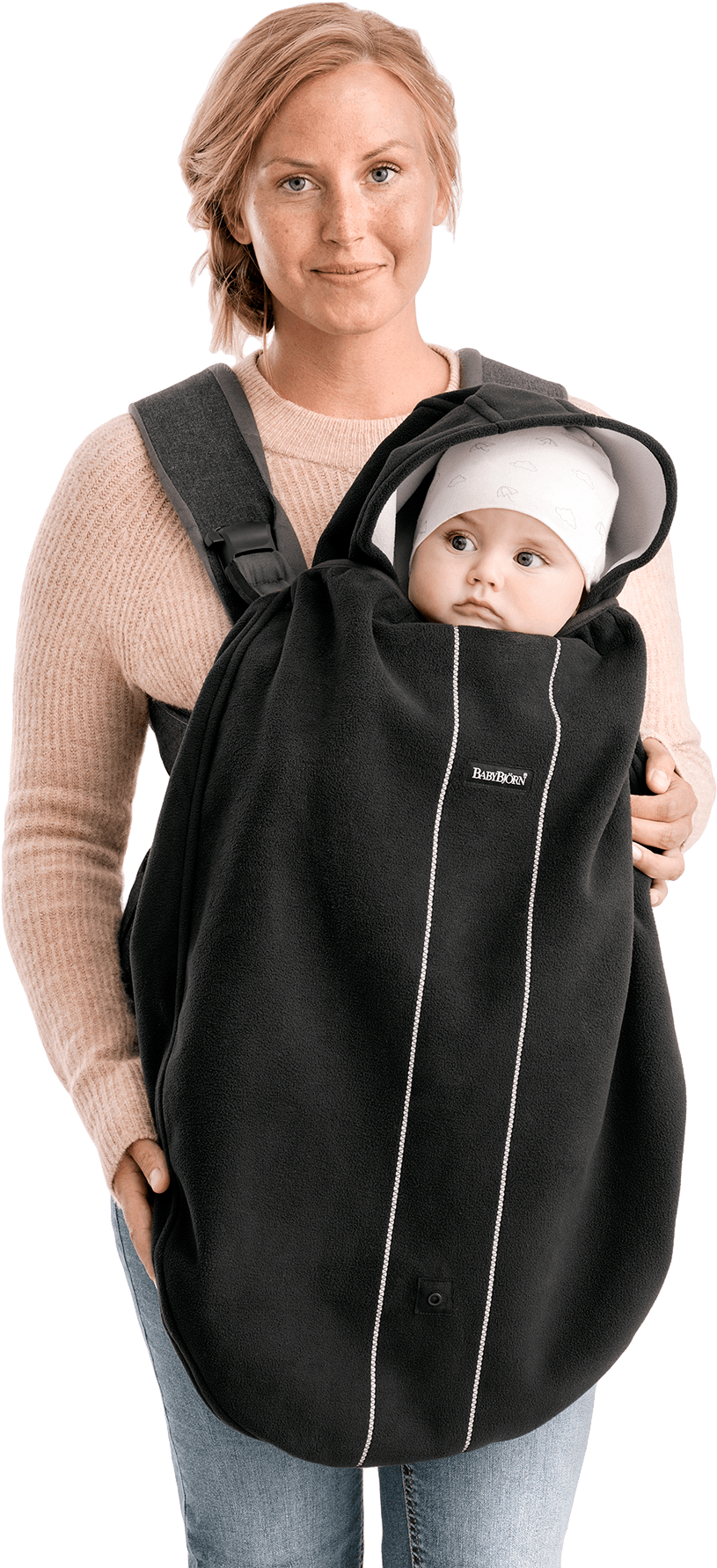 A Woman Carrying A Baby In A Black Blanket