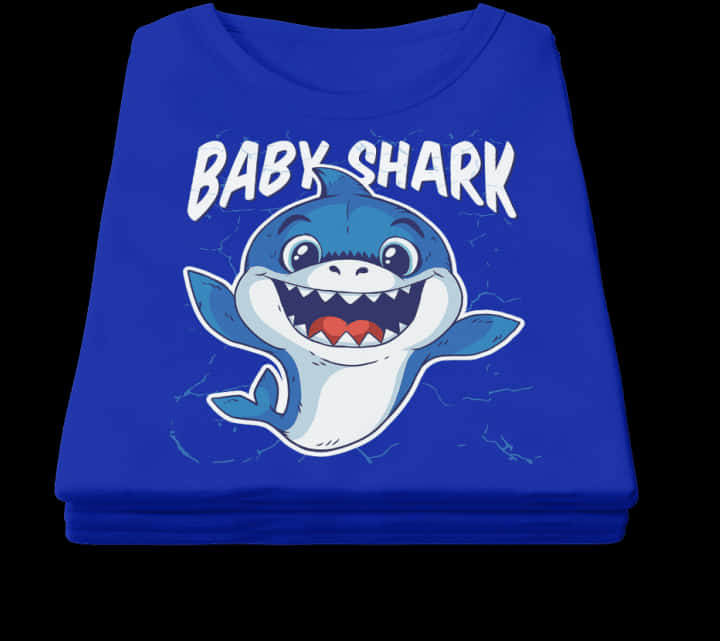 A Blue Shirt With A Cartoon Shark On It