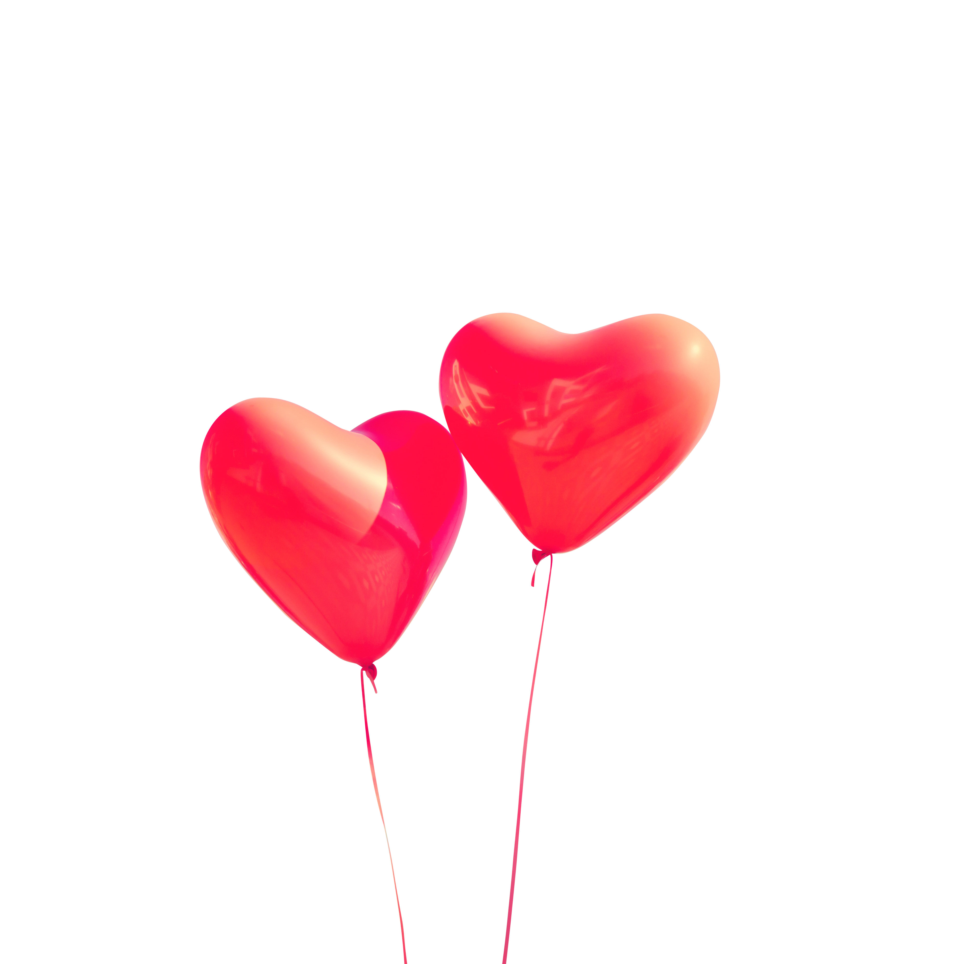 Two Red Balloons In The Shape Of A Heart