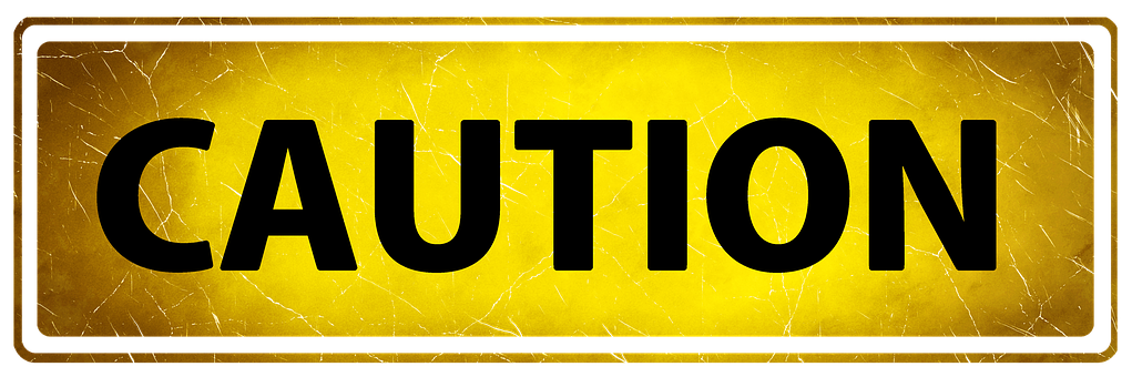 A Yellow Sign With Black Letters