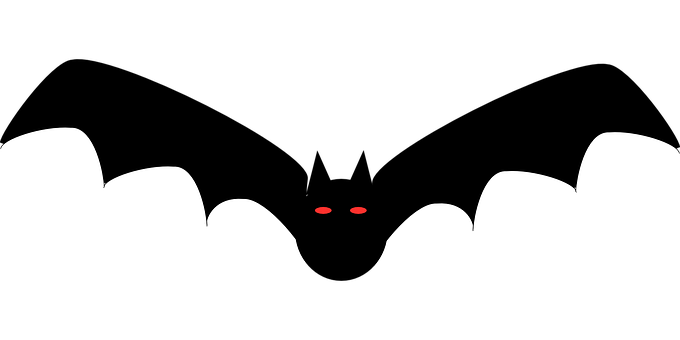 A Black And White Cat Face With Red Eyes And Teeth