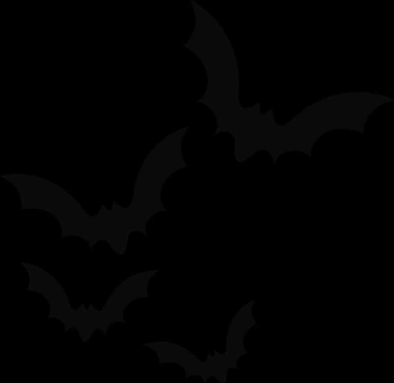 A Group Of Bats On A Black Background