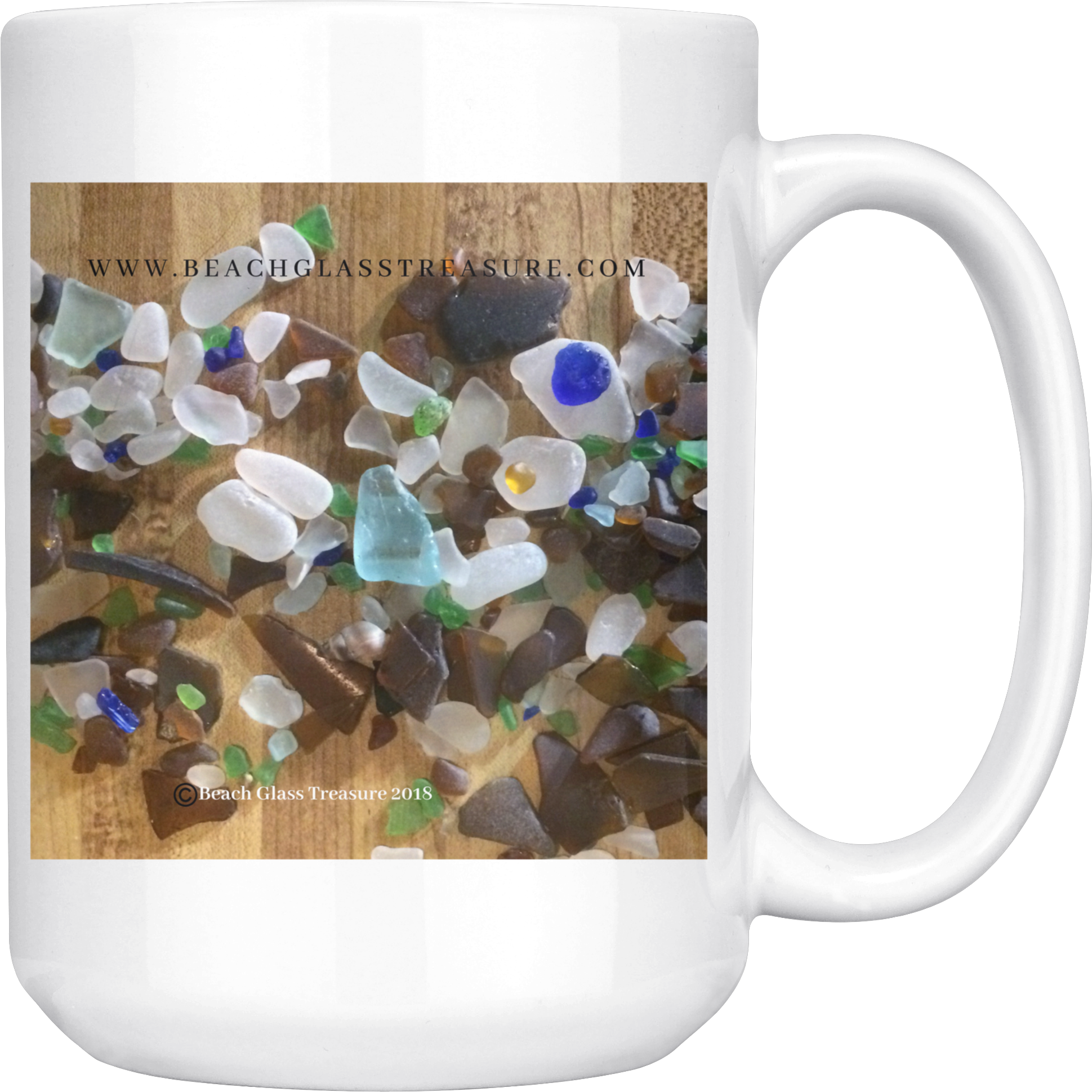 A White Mug With Sea Glass Pieces On It
