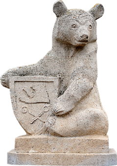 A Stone Statue Of A Bear Holding A Shield