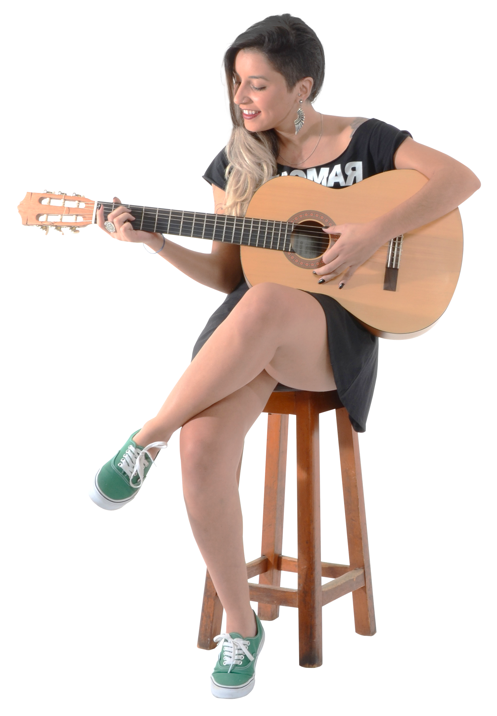 A Woman Sitting On A Stool Playing A Guitar