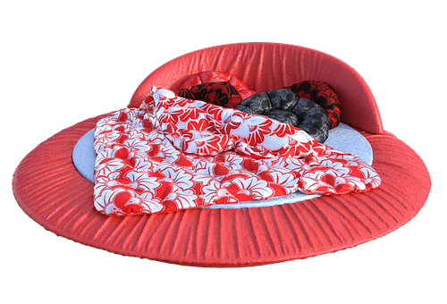 A Red Round Bed With A Blanket