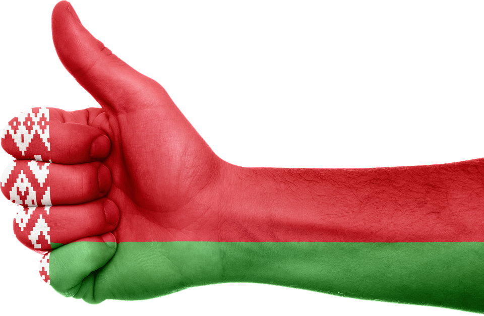 A Hand With A Red And Green Flag Painted On It