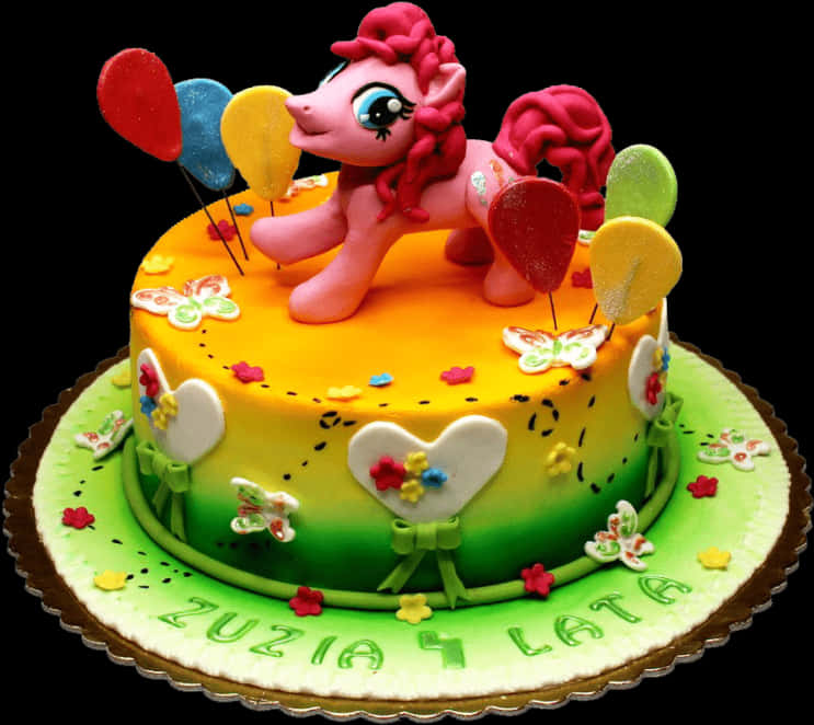 A Cake With A Pink Cartoon Horse On Top