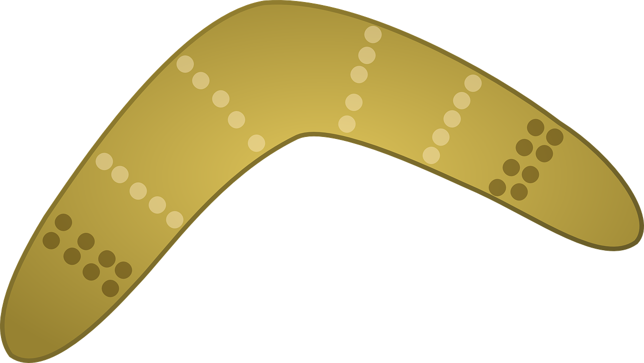 A Yellow Boomerang With White Dots