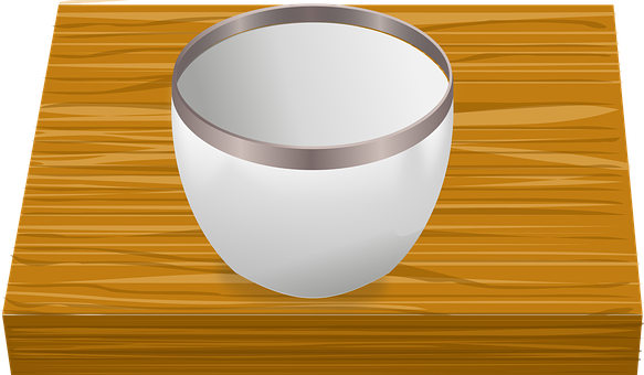A White Cup With Silver Rim On A Wood Surface