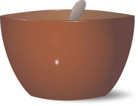 A Brown Bowl With A Spoon