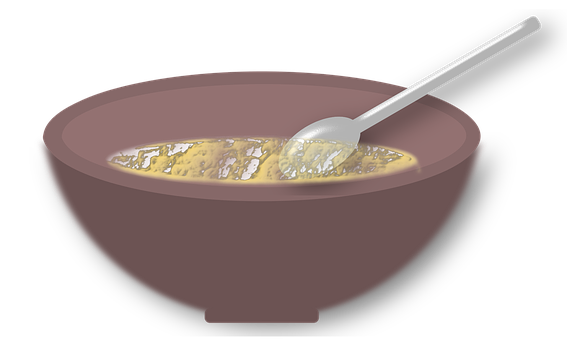 A Bowl Of Food With A Spoon