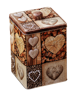 A Metal Box With Hearts And Stones