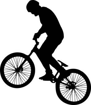 A Silhouette Of A Person On A Bicycle
