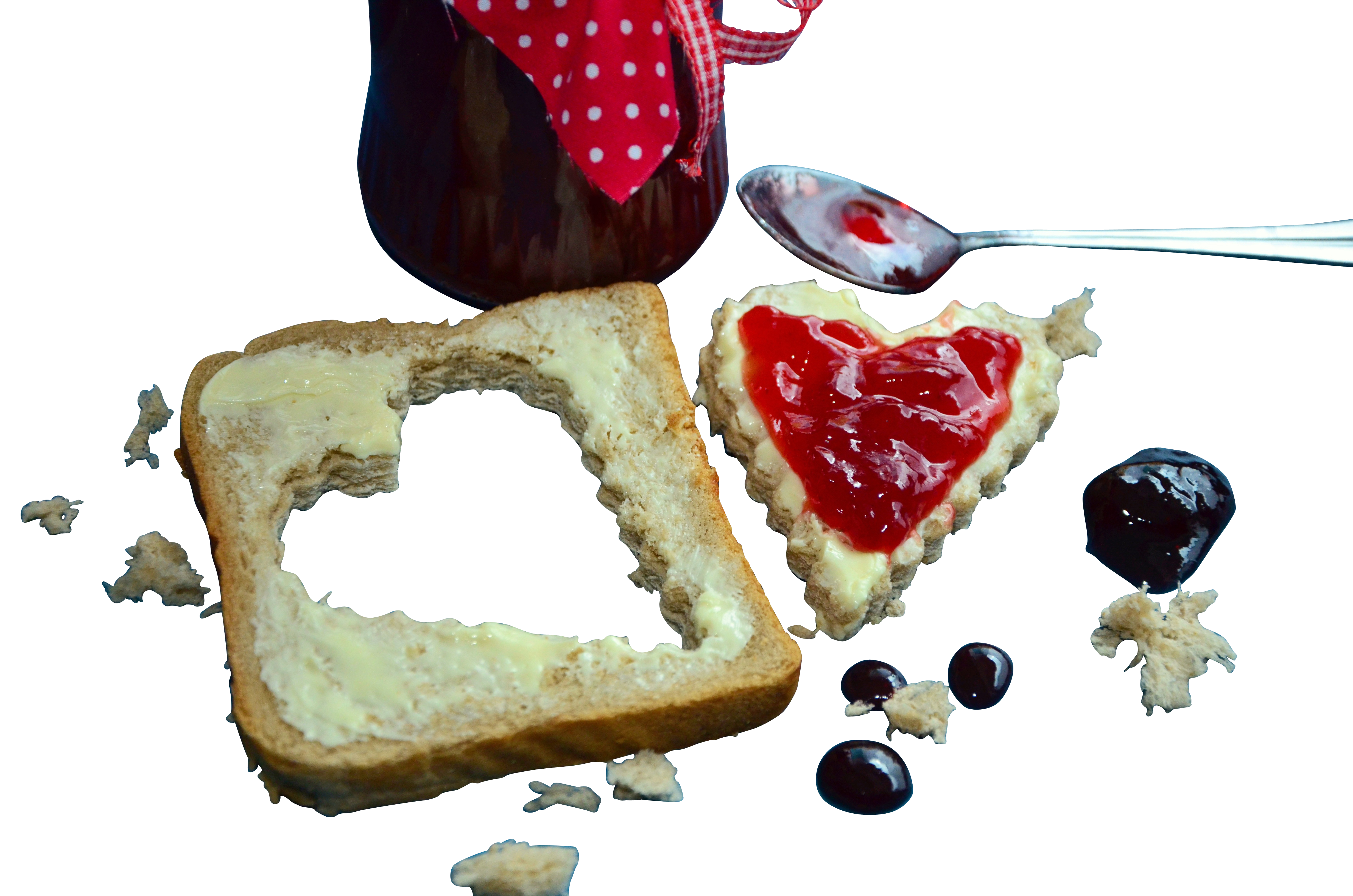 A Heart Shaped Bread With Jam On It