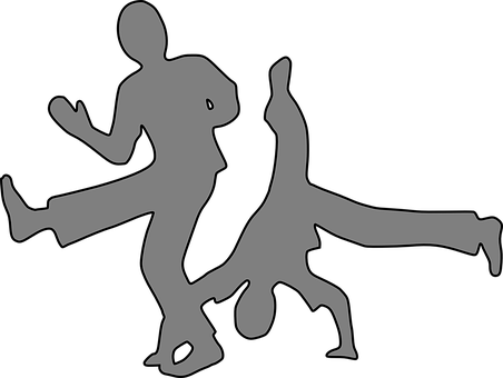 A Silhouette Of Two People Dancing