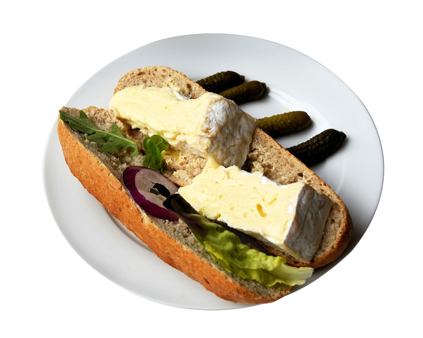 A Sandwich With Cheese And Pickles On A Plate