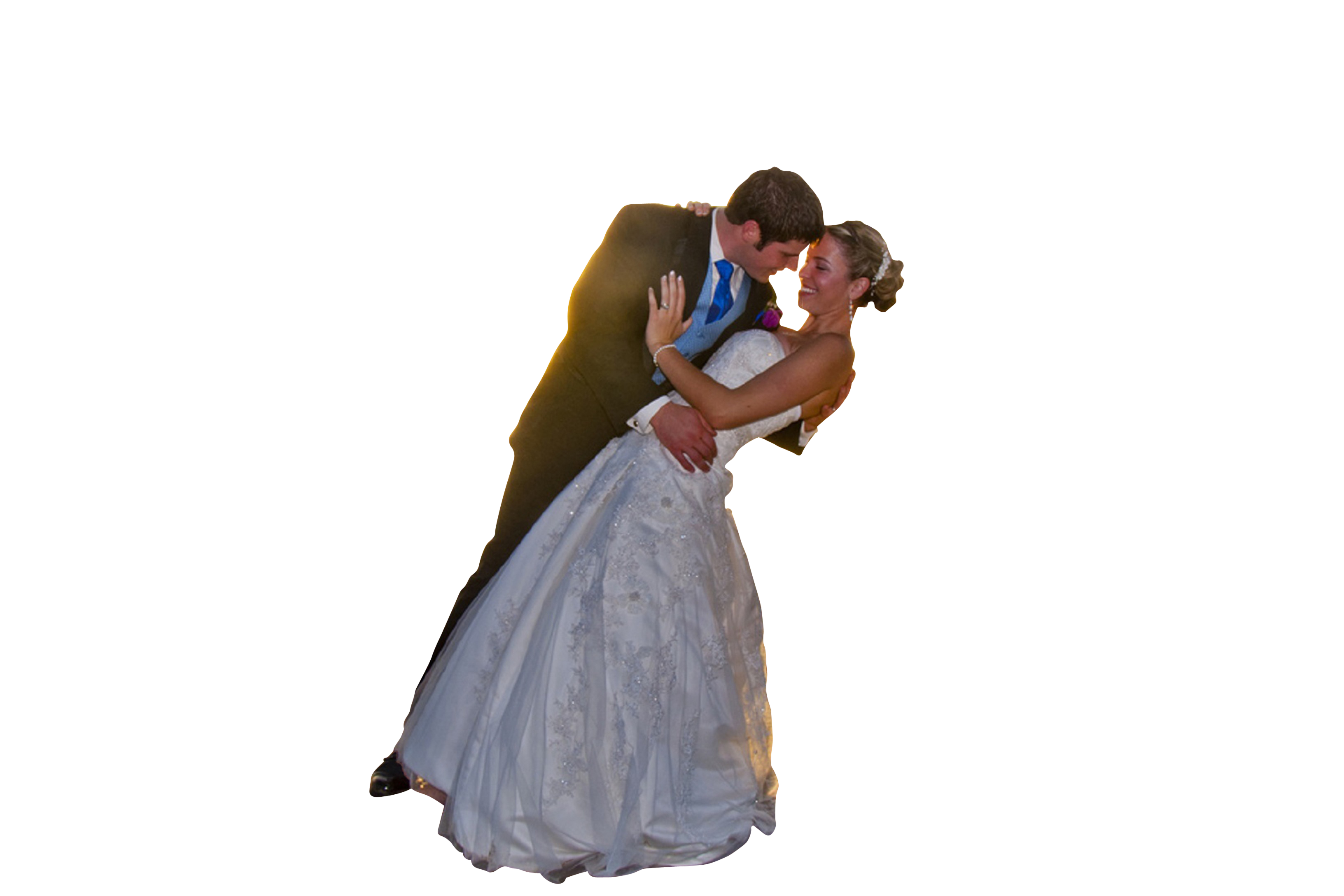 A Man And Woman In Wedding Attire Kissing