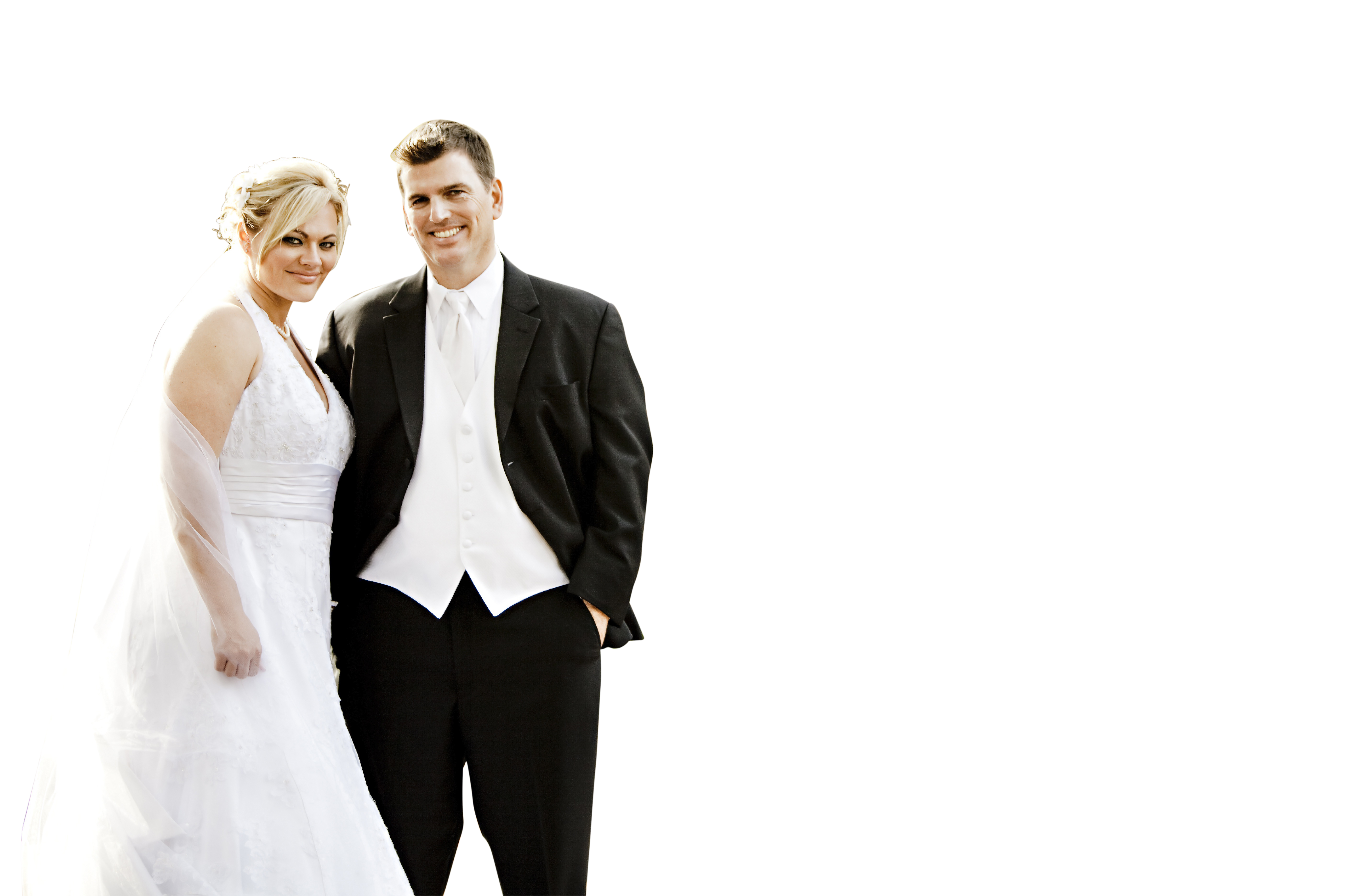 A Man And Woman In A White Dress And Tuxedo