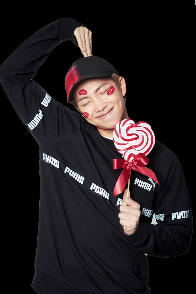 A Man Holding A Lollipop