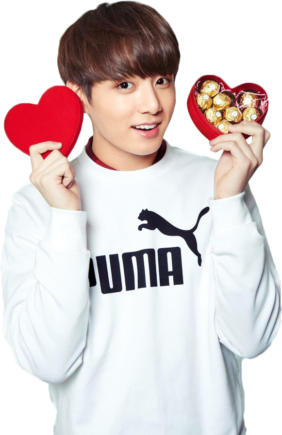 A Man Holding A Heart Shaped Box With Chocolates