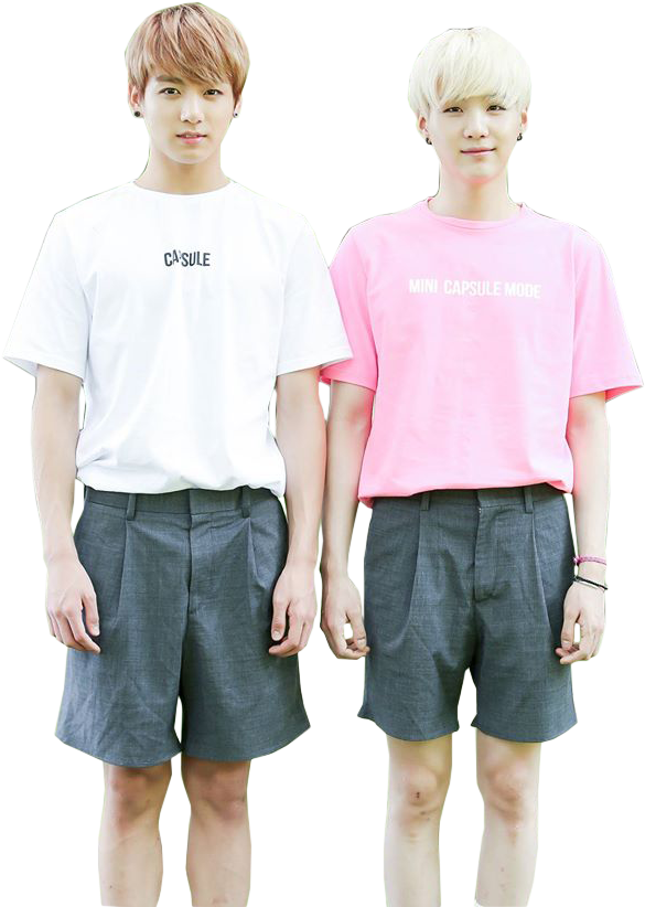 Two Young Men Wearing Matching Outfits