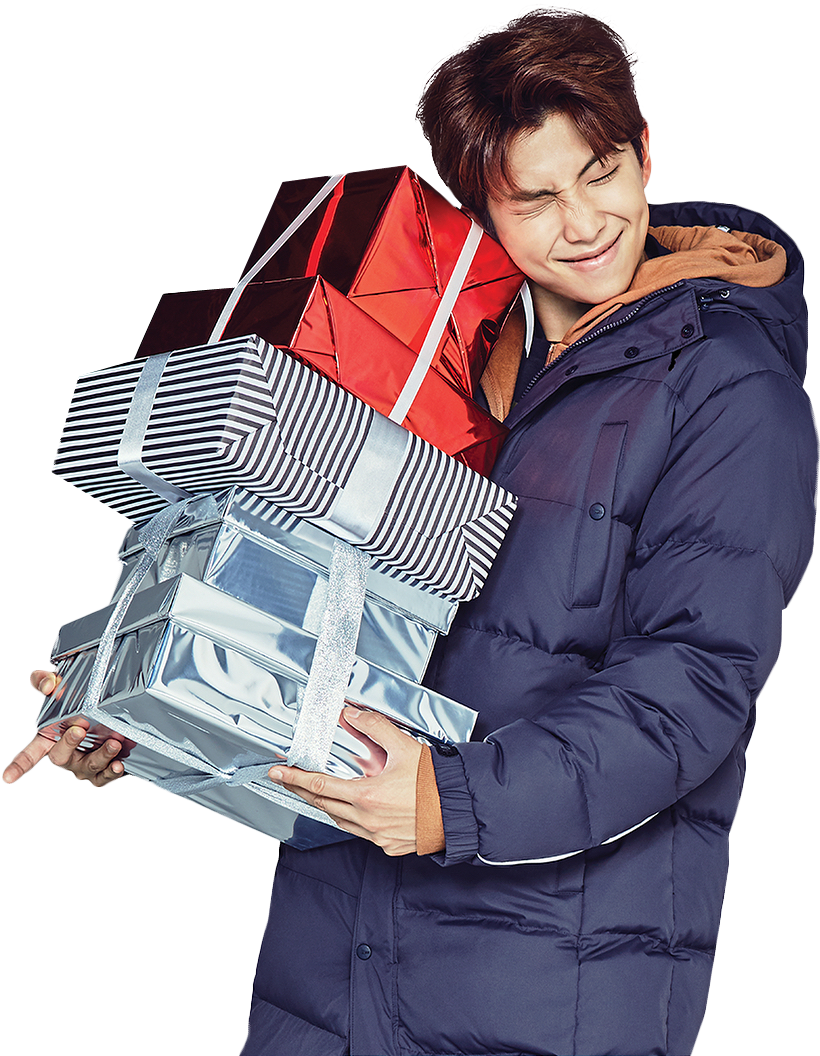 A Man Holding A Stack Of Presents