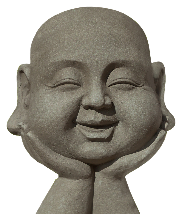 A Statue Of A Smiling Man