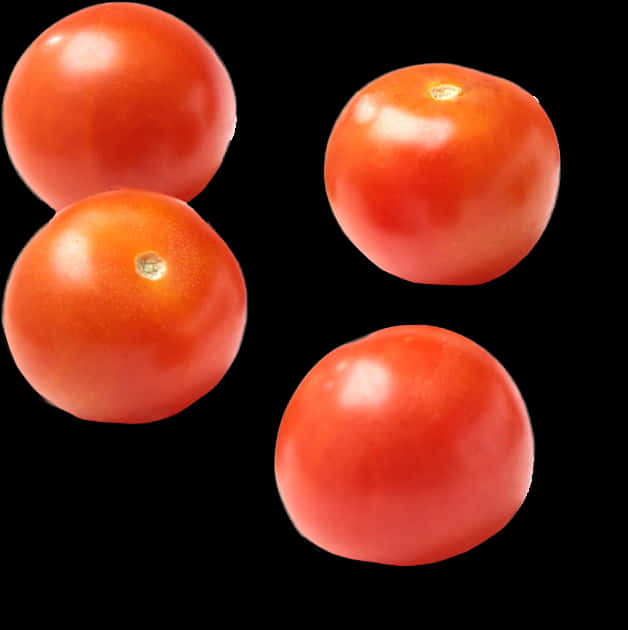 A Group Of Tomatoes On A Black Background