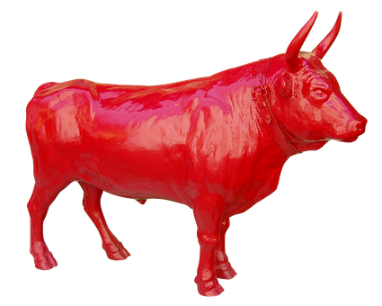 A Red Statue Of A Bull