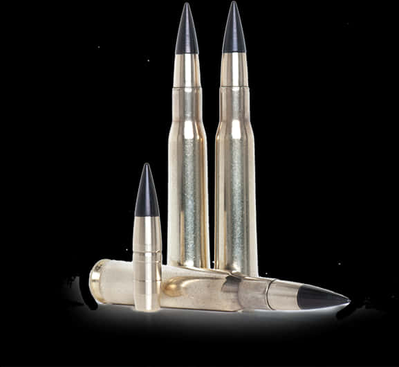 A Group Of Bullets With Black Tips