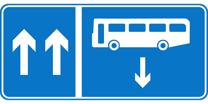 A Blue Sign With White Text And Arrows