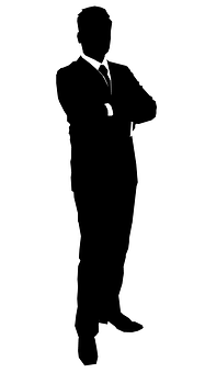 A Silhouette Of A Man With His Arms Crossed